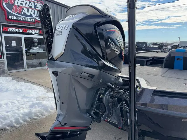 Slide: The Image of Outboard motor on a boat at Wieda's Marine dealership, featuring iKon LX20 model, 2025. - 3