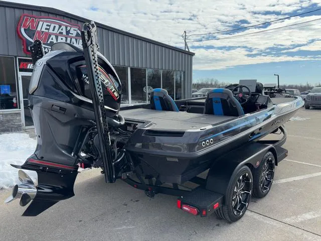 Slide: The Image of 2025 iKon LX20 boat at Wieda's Marine dealership, featuring a powerful outboard motor. - 5