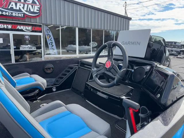 Slide: The Image of Interior of 2025 iKon LX20 boat with Garmin navigation system and blue seating. - 9