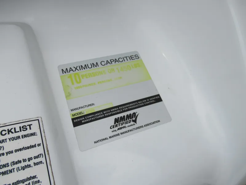 Slide: The Image of Maximum capacity label on Azure AZ208 boat, 2009 model, showing 10-person limit. - 14