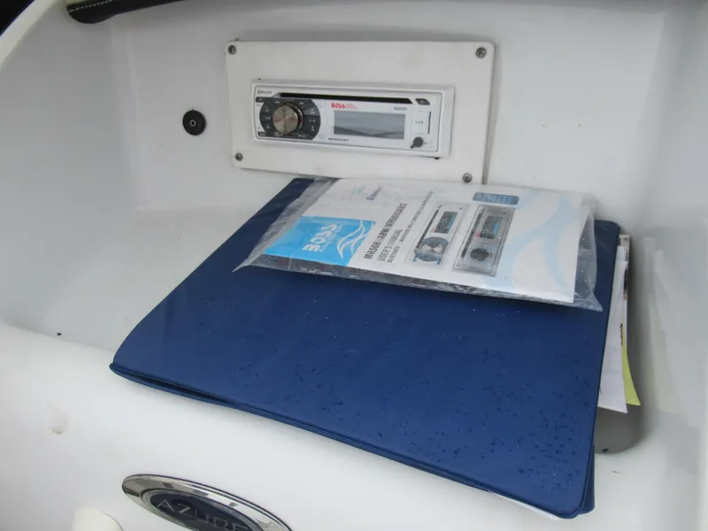Slide: The Image of Boat dashboard with stereo system and Azure AZ208 manual, 2009 model. - 15