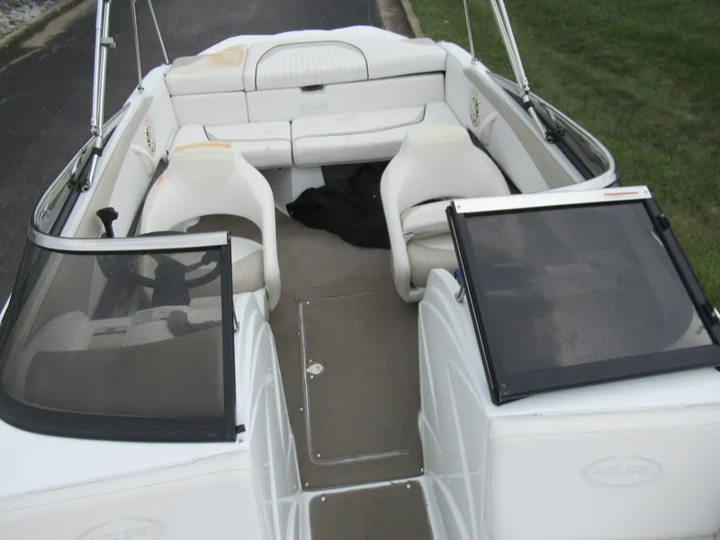 Slide: The Image of 2009 Azure AZ208 boat interior with white seating and open windshield. - 19