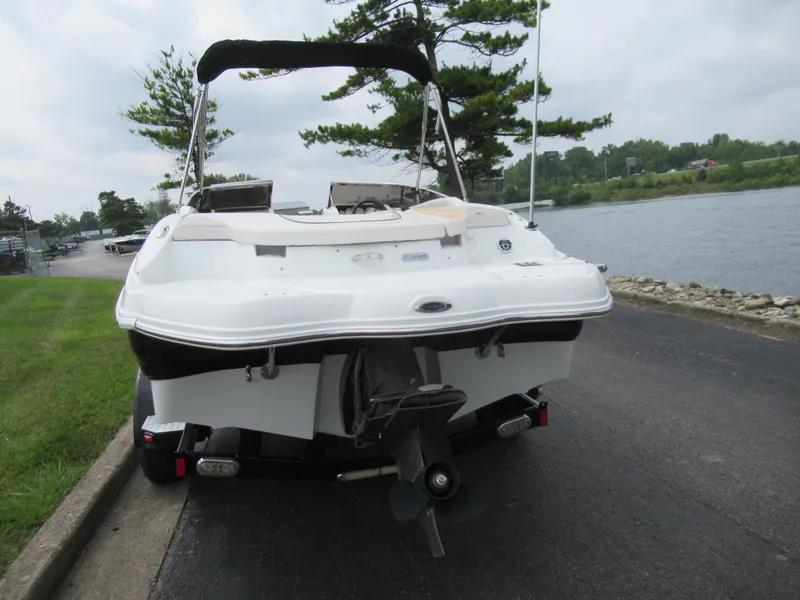 Slide: The Image of 2009 Azure AZ208 boat on trailer by lakeside road. - 2