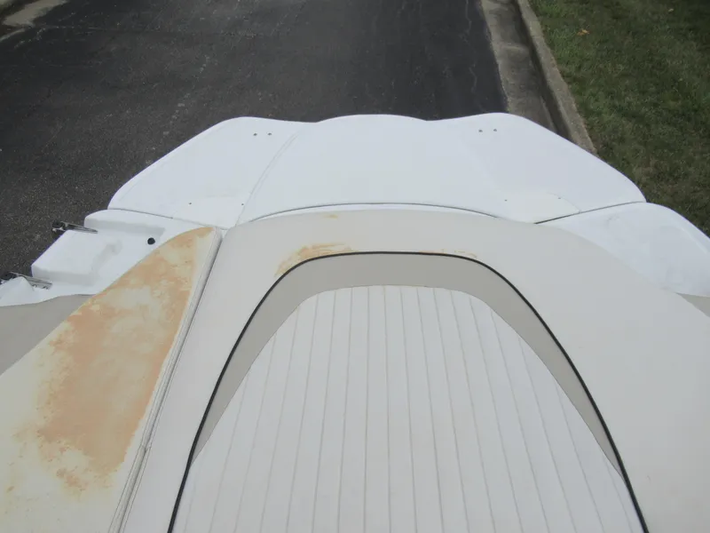 Slide: The Image of 2009 Azure AZ208 boat with worn upholstery and visible discoloration on the deck. - 22