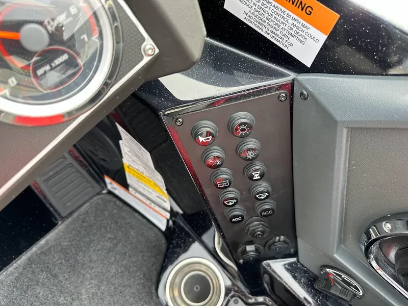 Slide: The Image of 2024 Ranger Z518 dashboard with control panel and gauges. - 18