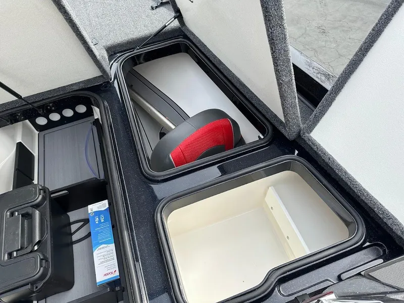 Slide: The Image of 2024 Ranger Z518 storage compartments with organized gear and equipment. - 28