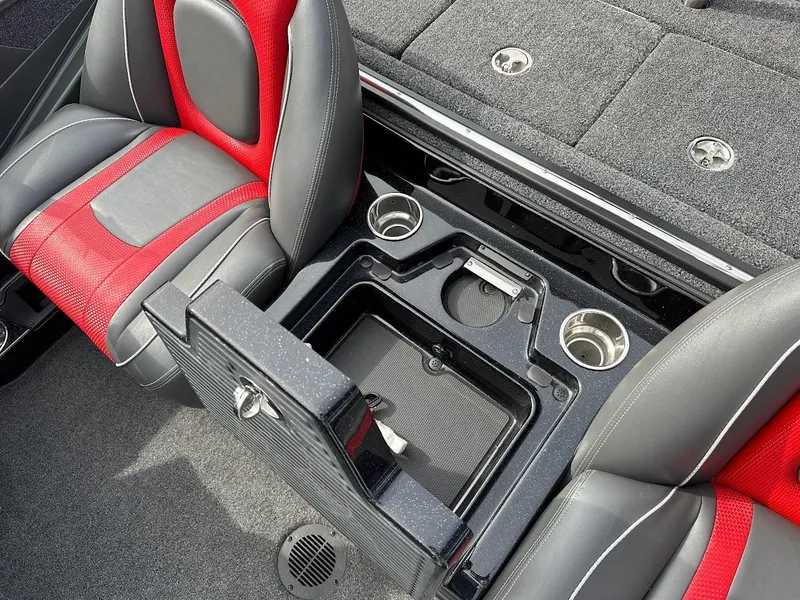 Slide: The Image of 2024 Ranger Z518 boat interior with red and gray seats, storage compartment, and cup holders. - 30