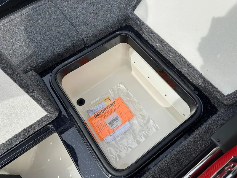 Slide: The Image of 2024 Ranger Z518 storage compartment with important documents inside. - 33