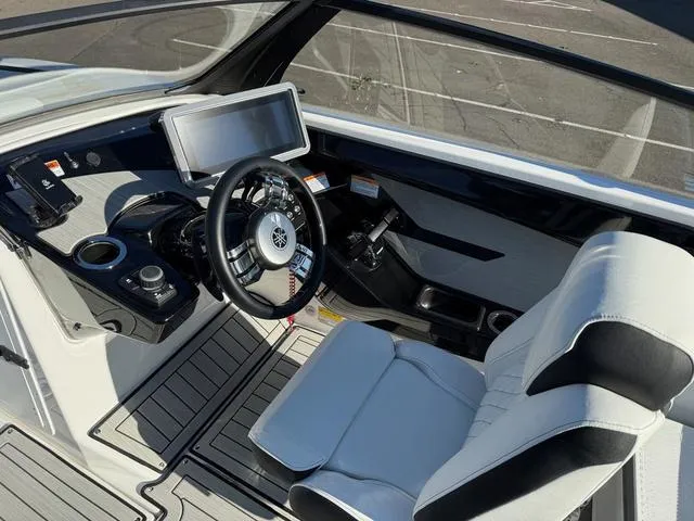 Slide: The Image of 2025 Yamaha Boats 222SD cockpit with modern steering and dashboard controls. - 5