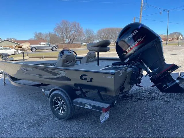 Slide: The Image of 2022 G3 Sportsman 1910 boat with Yamaha engine on trailer, parked outdoors. - 4