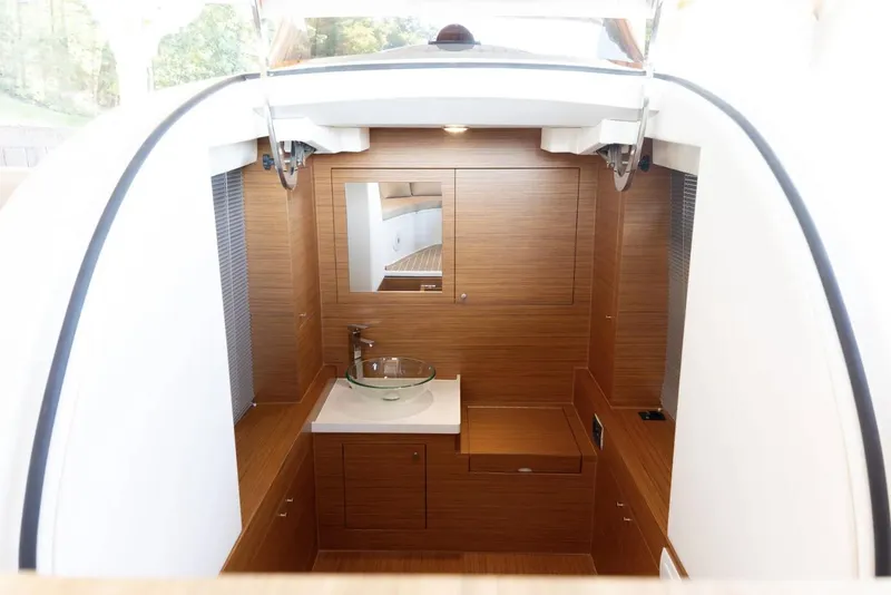Slide: The Image of 2022 Comitti Isola I-33 yacht interior with wooden cabinetry and modern sink. - 10