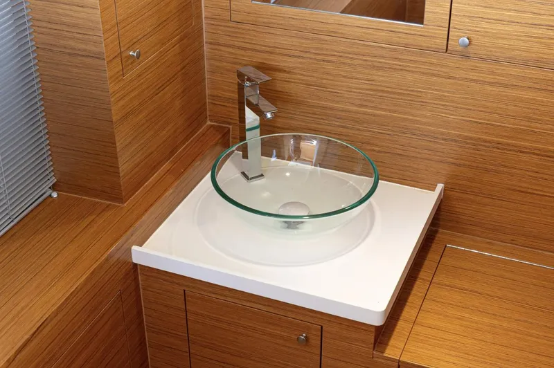 Slide: The Image of Modern bathroom sink with glass basin in 2022 Comitti Isola I-33 yacht. - 12