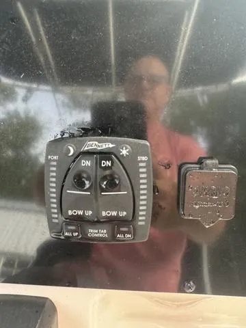 Slide: The Image of Bulls Bay 200CC 2023 boat trim tab control panel with reflection. - 14