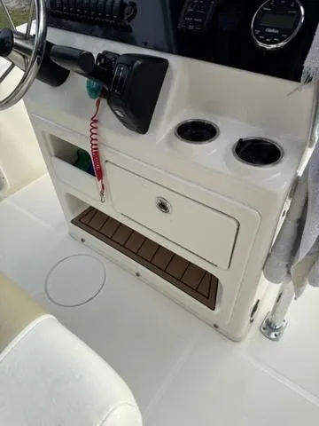 Slide: The Image of 2023 Bulls Bay 200CC boat console with storage, cup holders, and steering wheel. - 15