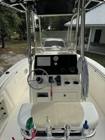 Slide: The Image of 2023 Bulls Bay 200CC boat interior with steering console and seating area. - 22