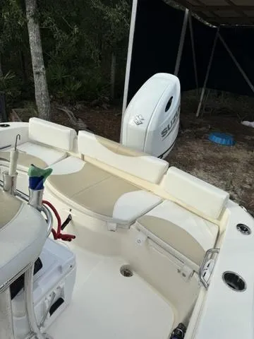 Slide: The Image of 2023 Bulls Bay 200CC boat interior with seating and Suzuki outboard motor. - 23