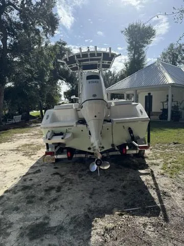 Slide: The Image of 2023 Bulls Bay 200CC boat on trailer, parked outdoors near a house. - 3