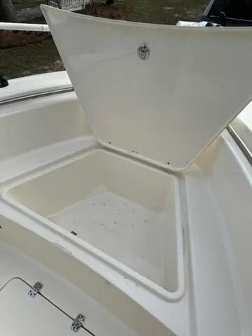 Slide: The Image of 2023 Bulls Bay 200CC boat storage compartment with open lid, showcasing spacious interior. - 8