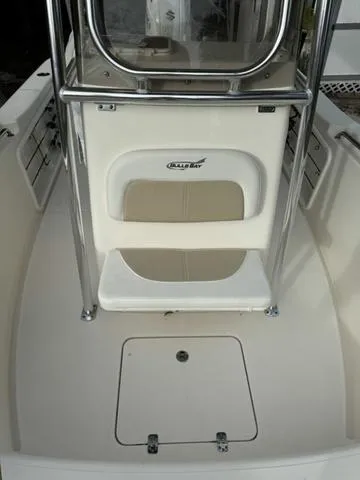 Slide: The Image of 2023 Bulls Bay 200CC boat interior with seating and storage area. - 9