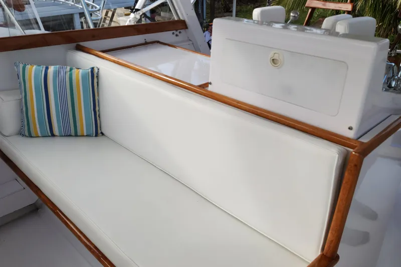 Slide: The Image of 1971 Whiticar Sportfish boat with white seating and striped cushion. - 29