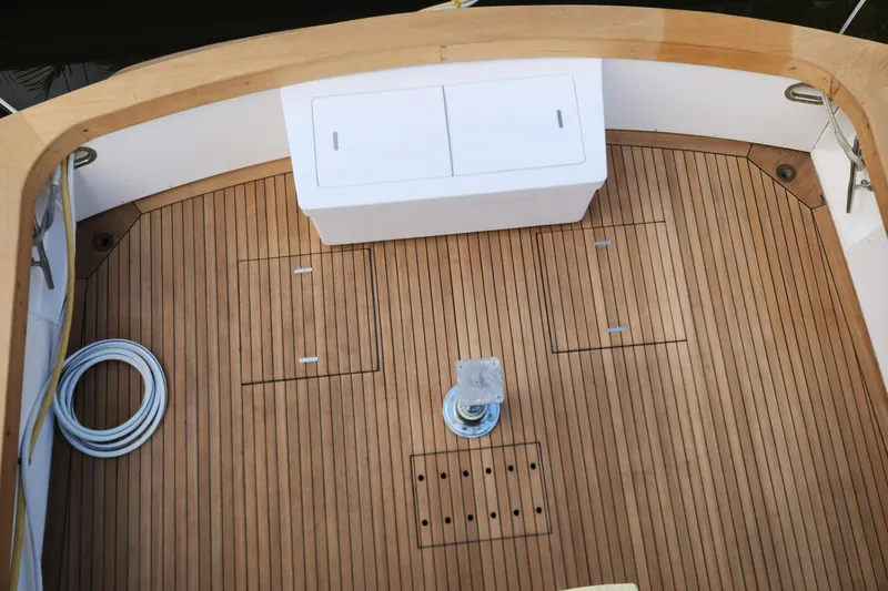 Slide: The Image of 1971 Whiticar Sportfish boat deck with teak flooring and storage compartments. - 34
