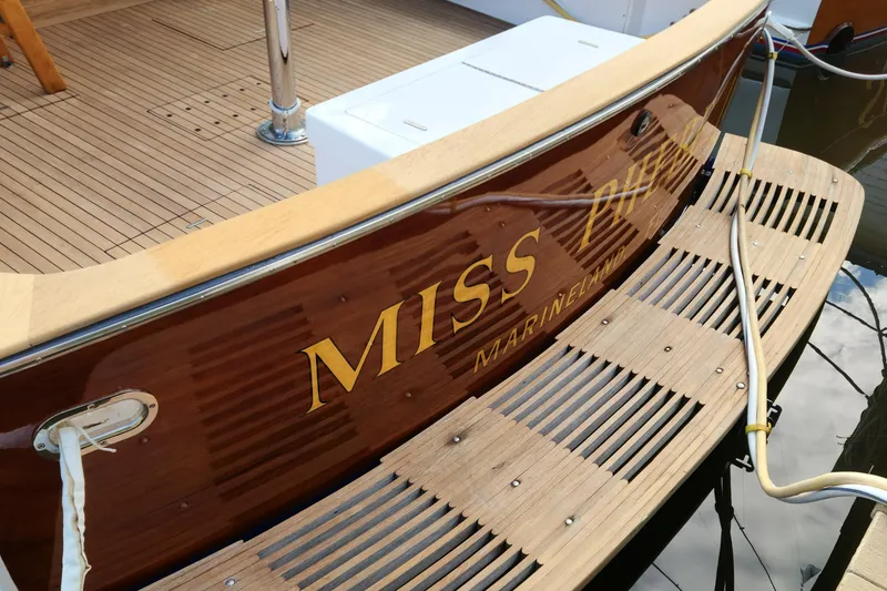 Slide: The Image of 1971 Whiticar Sportfish boat with wooden deck and "Miss" nameplate. - 36