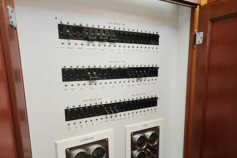 Slide: The Image of Electrical panel of a 1971 Whiticar Sportfish boat with labeled switches and gauges. - 41