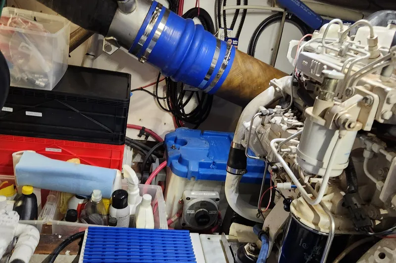 Slide: The Image of Engine room of a 1971 Whiticar Sportfish boat, featuring various mechanical components and equipment. - 43