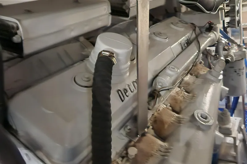 Slide: The Image of 1971 Whiticar Sportfish engine close-up, showcasing mechanical components and details. - 44