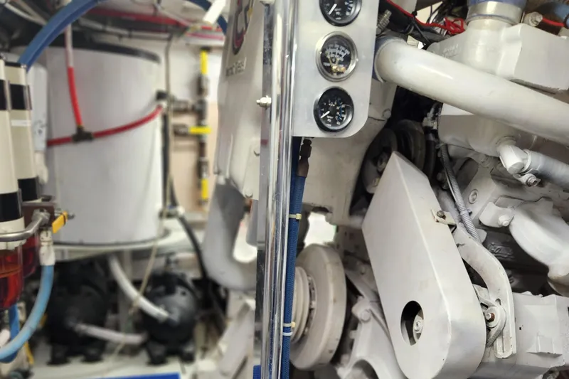 Slide: The Image of Engine room of a 1971 Whiticar Sportfish boat, showcasing mechanical components and gauges. - 45