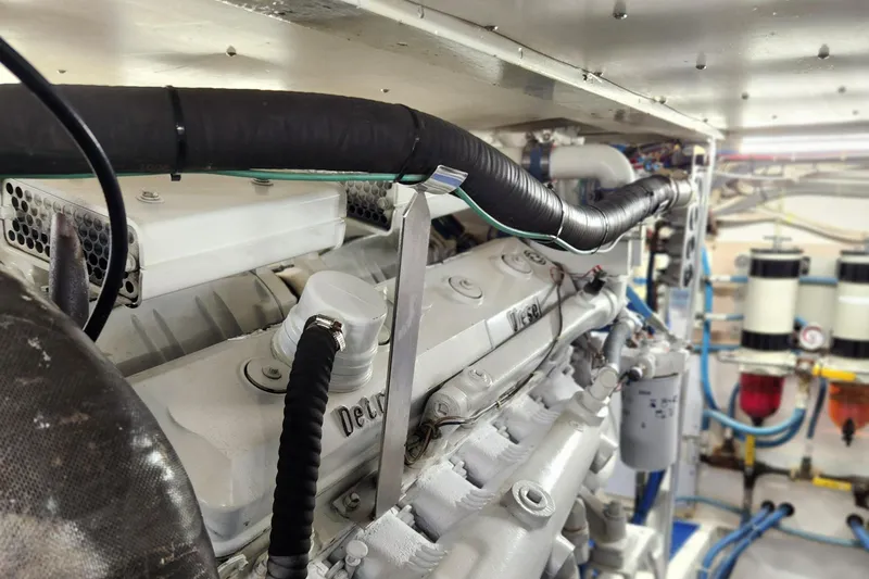 Slide: The Image of Engine room of a 1971 Whiticar Sportfish boat, showcasing detailed mechanical components. - 47