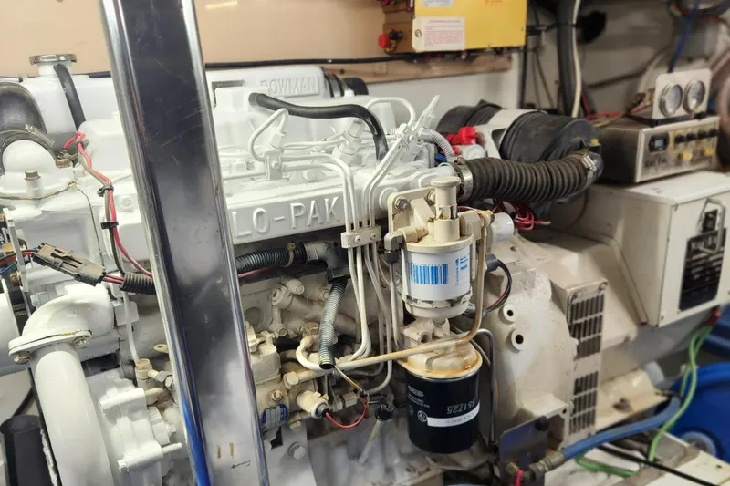 Slide: The Image of Engine room of a 1971 Whiticar Sportfish boat, showcasing detailed mechanical components. - 48