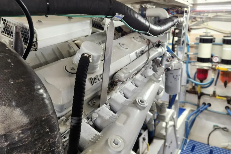 Slide: The Image of Engine room of a 1971 Whiticar Sportfish boat, showcasing detailed machinery and components. - 50
