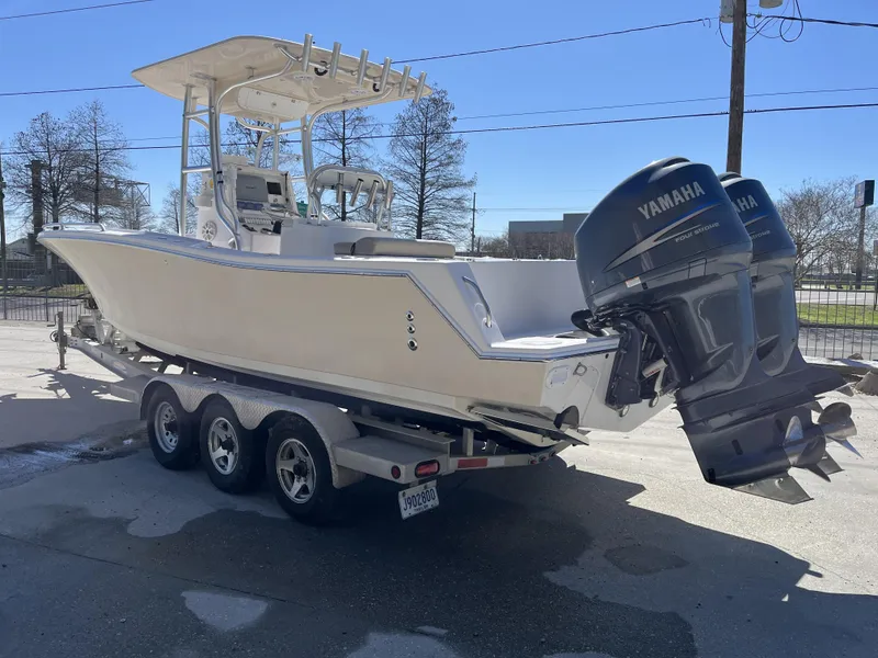 Slide: The Image of 2010 Ocean Runner 29 cc boat on trailer with dual Yamaha engines. - 15