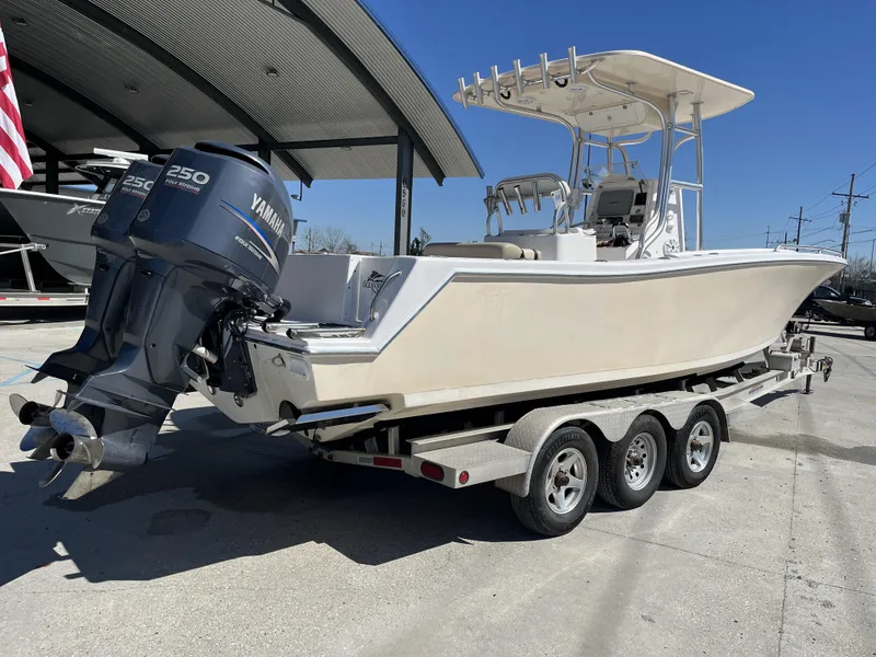 Slide: The Image of 2010 Ocean Runner 29 cc boat on trailer with Yamaha outboard engines. - 17