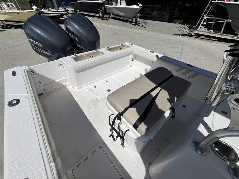 Slide: The Image of 2010 Ocean Runner 29 cc boat with dual Yamaha engines, spacious deck, and seating area. - 22