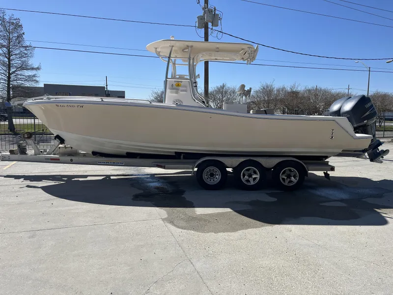 Slide: The Image of 2010 Ocean Runner 29 cc boat on a trailer, parked outdoors. - 3