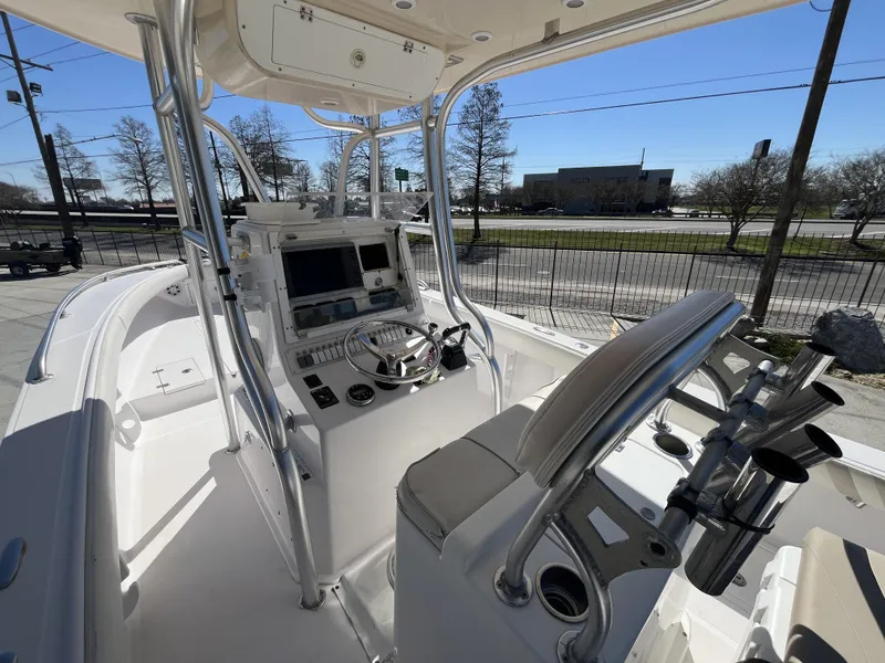 Slide: The Image of 2010 Ocean Runner 29 cc boat interior with steering console and seating. - 5