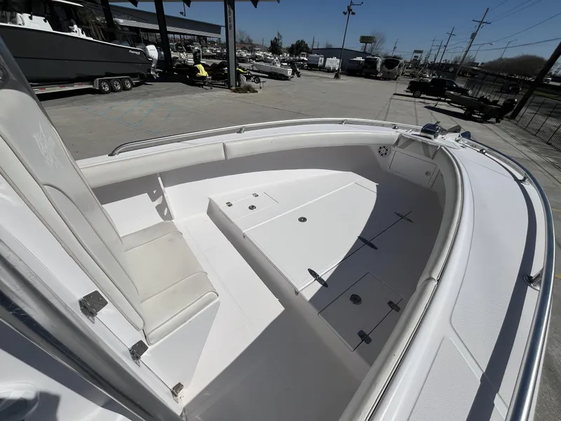 Slide: The Image of 2010 Ocean Runner 29 cc boat interior, featuring spacious seating and storage compartments. - 6