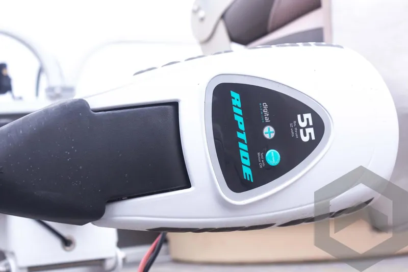 Slide: The Image of Close-up of Riptide 55 trolling motor on 2015 Sun Tracker Fishin' Barge 22 DLX. - 16