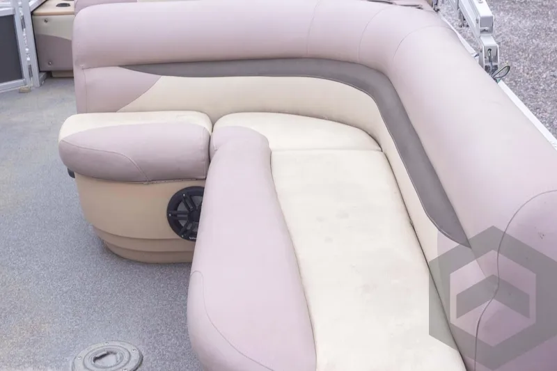 Slide: The Image of 2015 Sun Tracker Fishin' Barge 22 DLX interior seating with beige upholstery. - 21