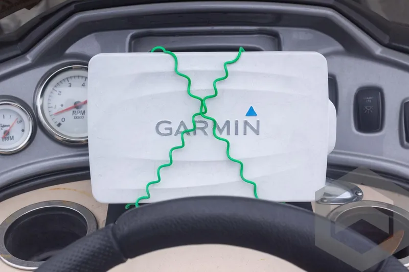 Slide: The Image of Garmin device on Sun Tracker Fishin' Barge 22 DLX dashboard, 2015 model. - 25