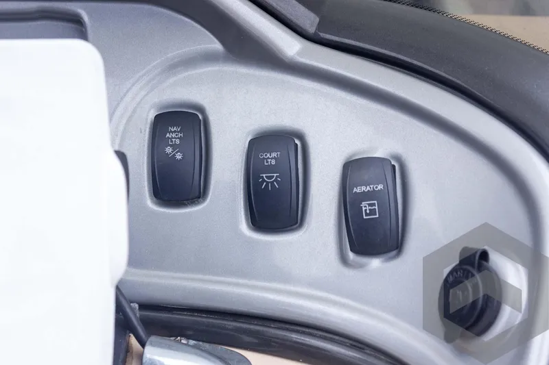 Slide: The Image of Control panel of 2015 Sun Tracker Fishin' Barge 22 DLX with switches for lights and aerator. - 27