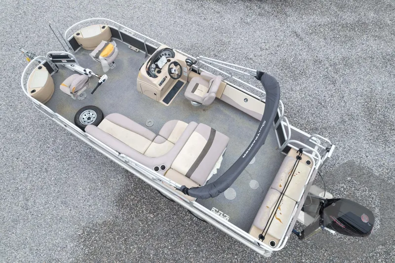 Slide: The Image of 2015 Sun Tracker Fishin' Barge 22 DLX pontoon boat, aerial view, spacious seating, and fishing setup. - 39