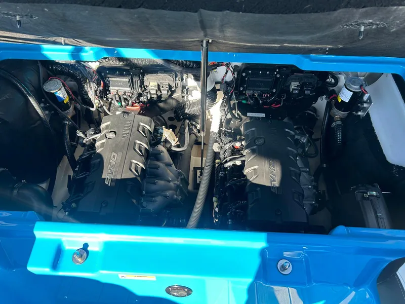 Slide: The Image of 2023 Yamaha Boats 255XD engine compartment with dual engines and wiring. - 14