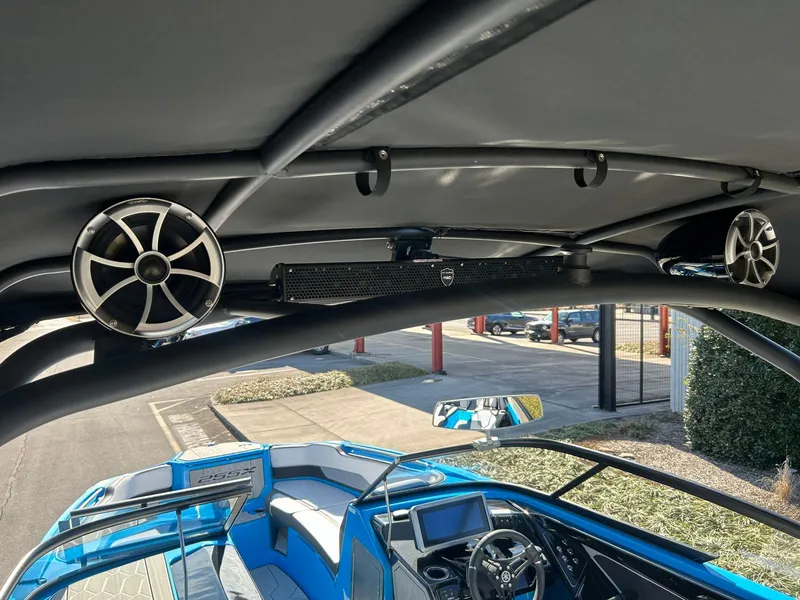 Slide: The Image of 2023 Yamaha Boats 255XD interior with speakers and dashboard view. - 9
