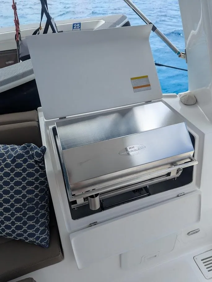 Slide: The Image of Seawind 1260 yacht with stainless steel grill, 2020 model, ocean backdrop. - 11