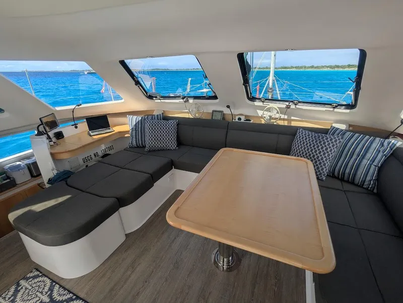 Slide: The Image of Interior of 2020 Seawind 1260 catamaran with modern seating and ocean view. - 14