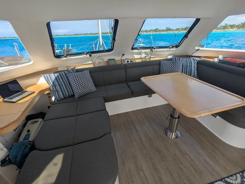 Slide: The Image of Interior of 2020 Seawind 1260 catamaran with spacious seating and ocean view. - 15
