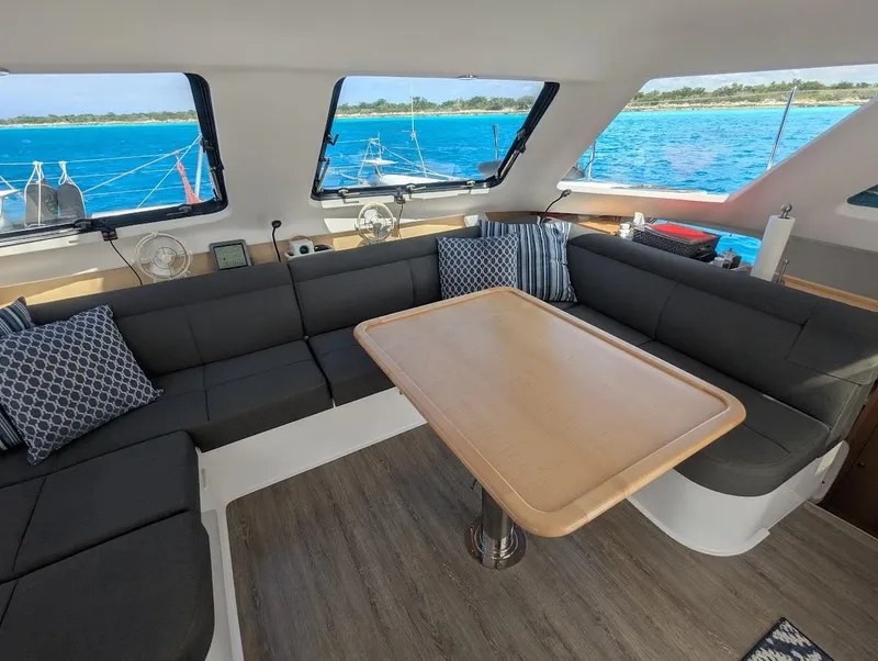 Slide: The Image of Interior of 2020 Seawind 1260 catamaran with spacious seating and ocean view. - 17